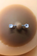 paire-de-cache-ttons-piercing-barre-faux-diamant-peau-fonce